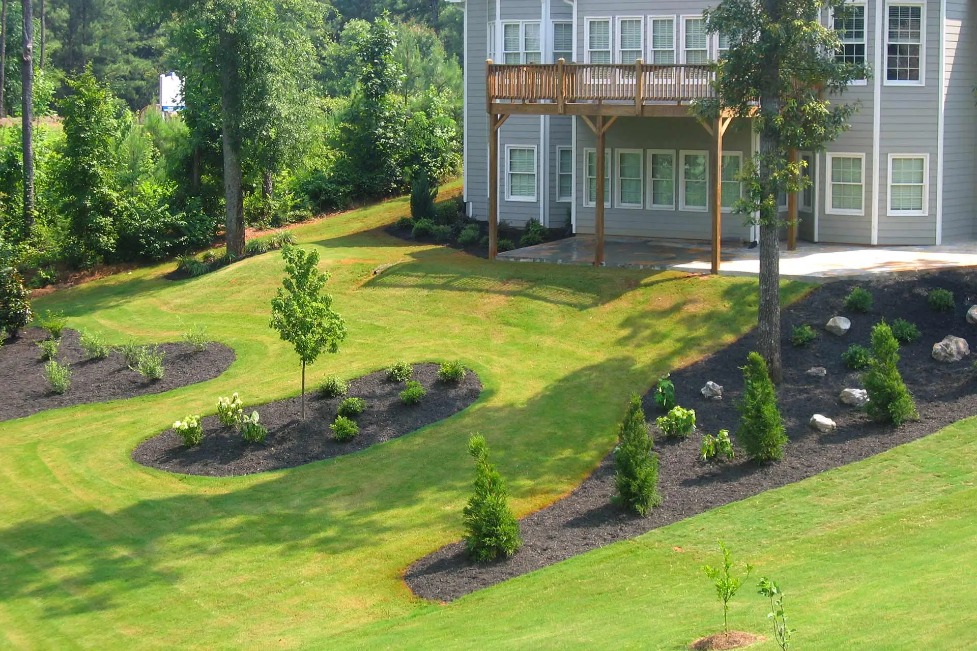 Elevated landscaping and mulch beds at a home property in Buckhead, GA.