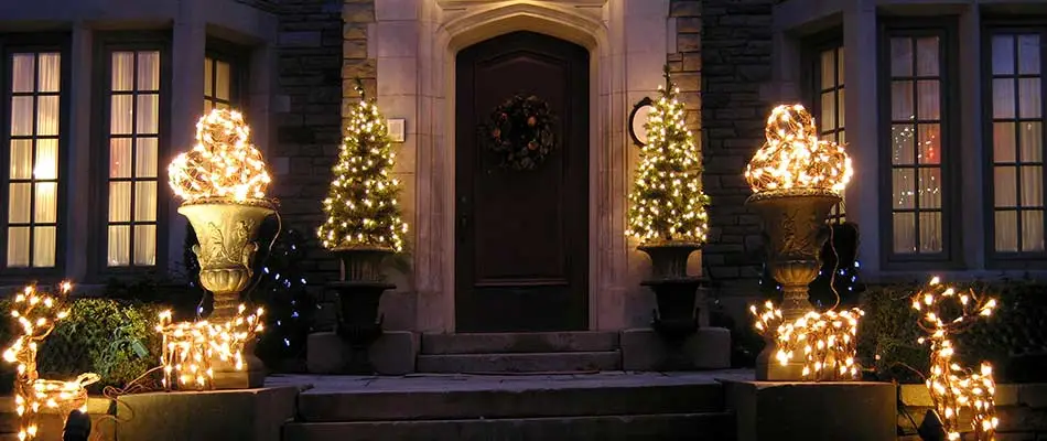 Holiday lighting installed around a home's front door in Smyrna, GA.