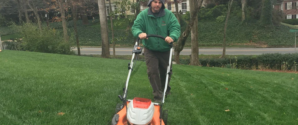 One of our employees mowing a property in Buckhead, GA.