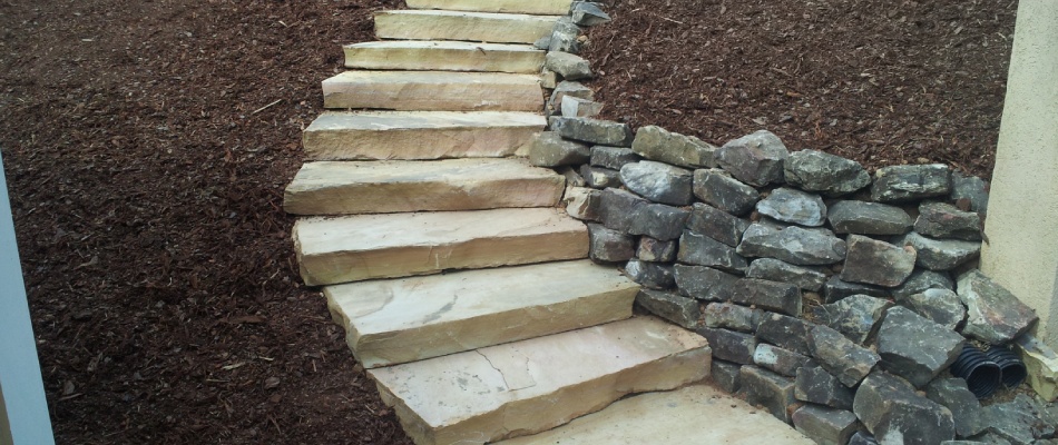 Retaining wall and outdoor steps installed for a client in Peachtree City, GA.
