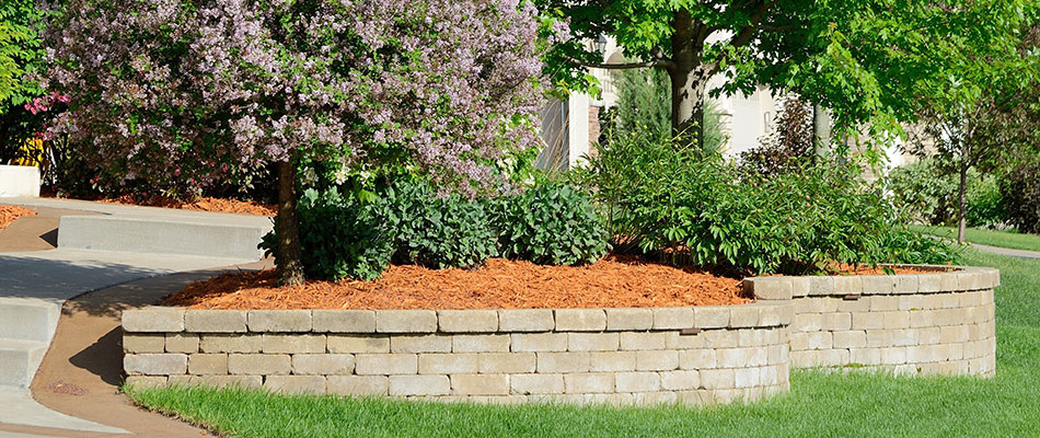 Retaining wall with landscape bed at home in Buckhead, GA. 