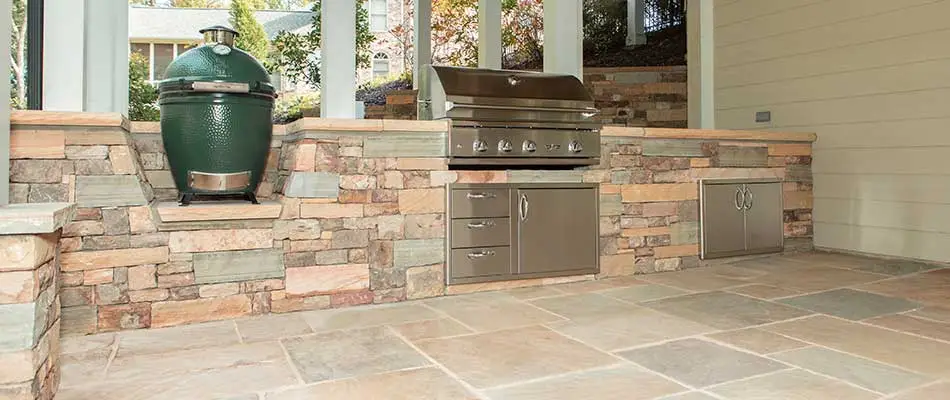 Outdoor kitchen and paver patio at a home in Atlanta, GA.